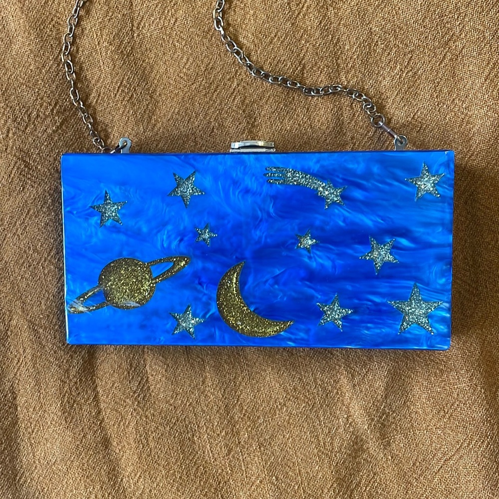 Moon and stars acrylic clutch bag in cobalt blue